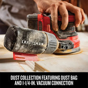 Photo of Craftsman cordless sander with dust bag, SKU CMCW220B, collecting dust on wood surface.