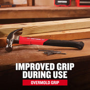 Photo of Craftsman claw hammer CMHT51398 with red handle and nails on workbench.