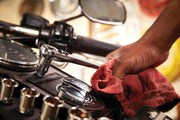 Photo of CRAFTSMAN ratchet wrench, SKU CMMT12042, in use on motorcycle console, close-up angle.